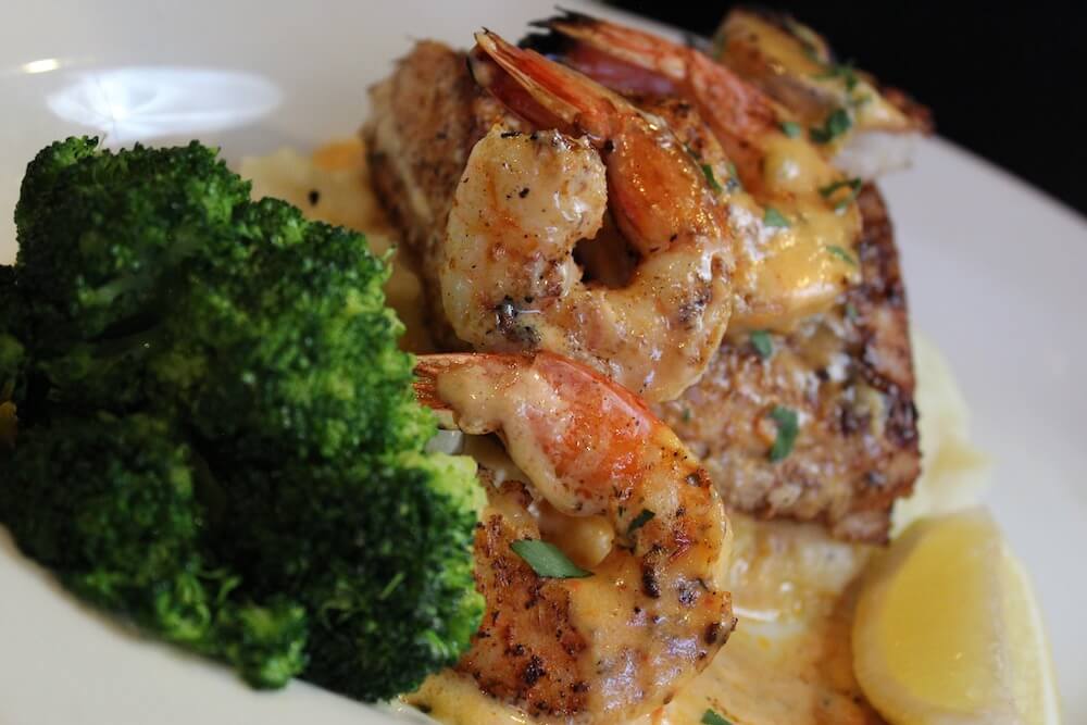 Grilled shrimp, steak, and broccoli with lemon