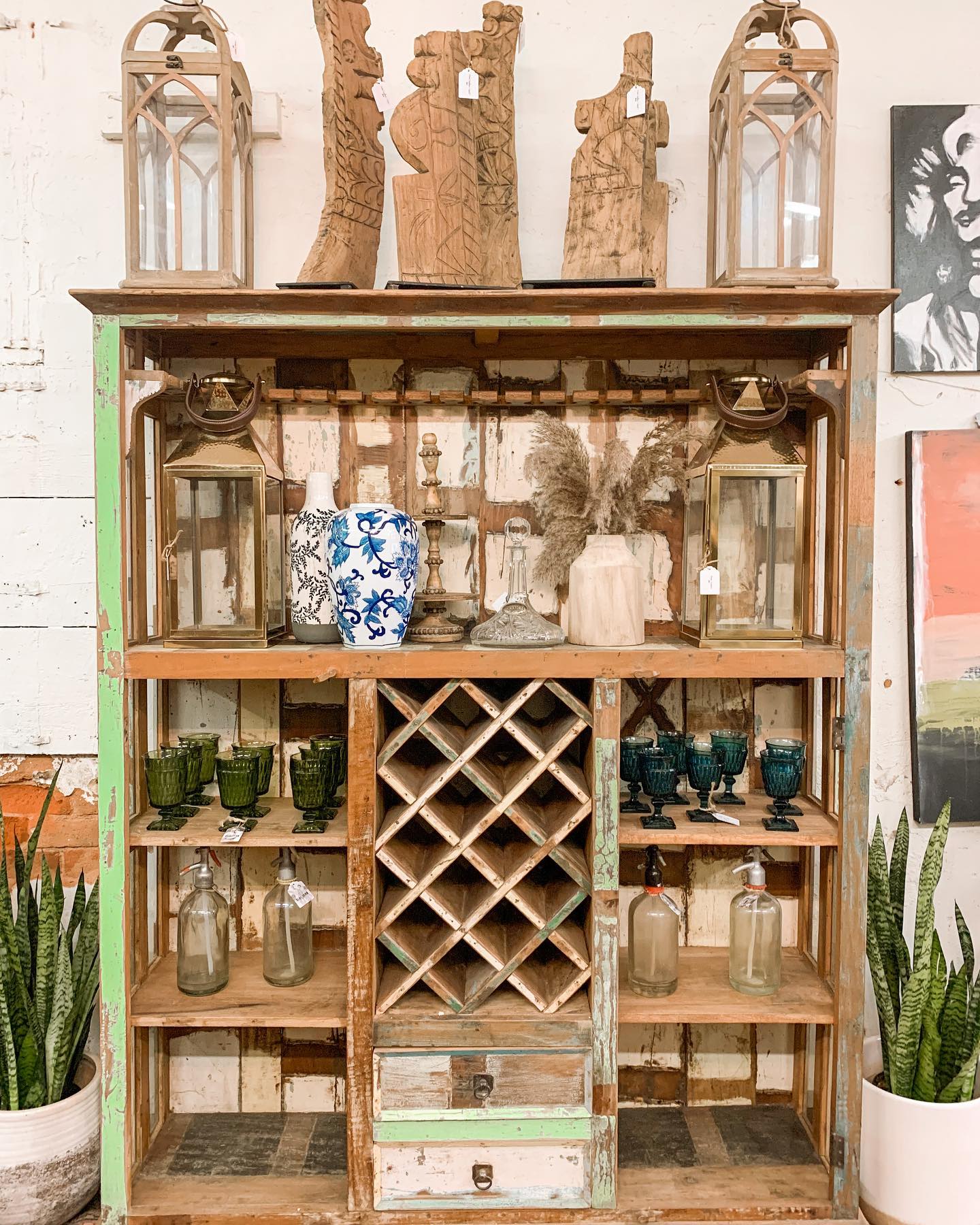 Display shelf with scupltures at Blue Fern boutique