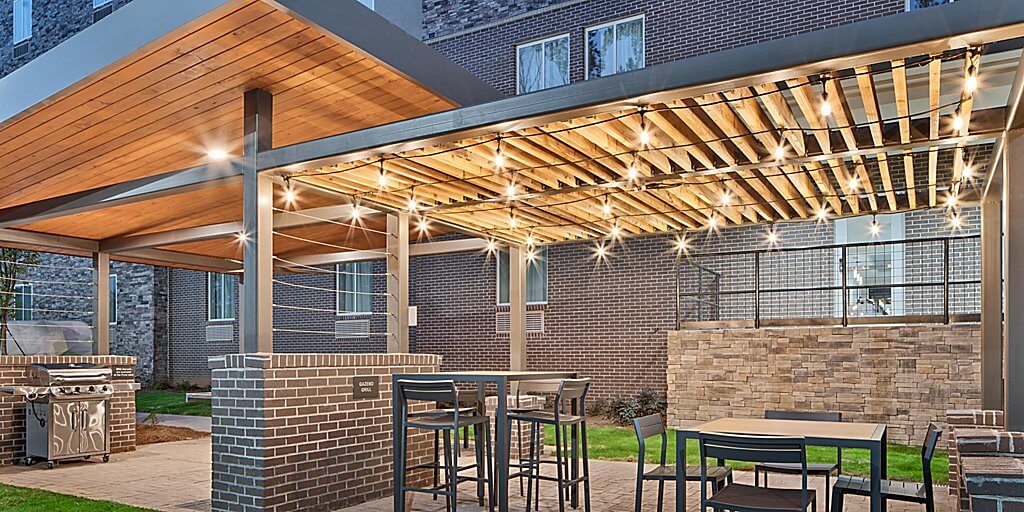 Beautiful patio with string lights for guests of the Candlewood Suites in Newnan