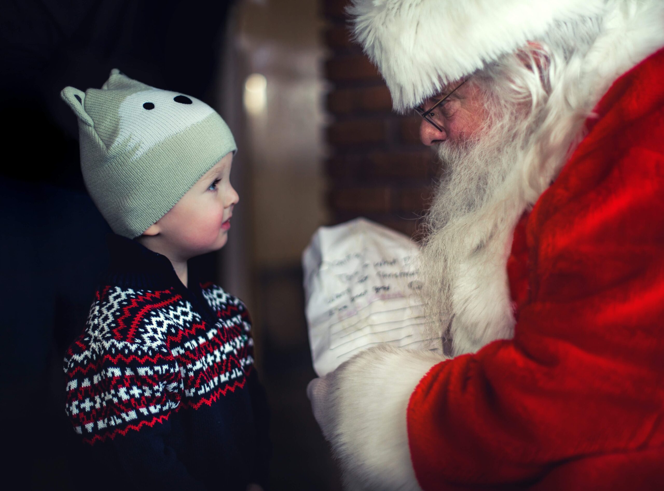 Little boy chatting with Santa Claus
