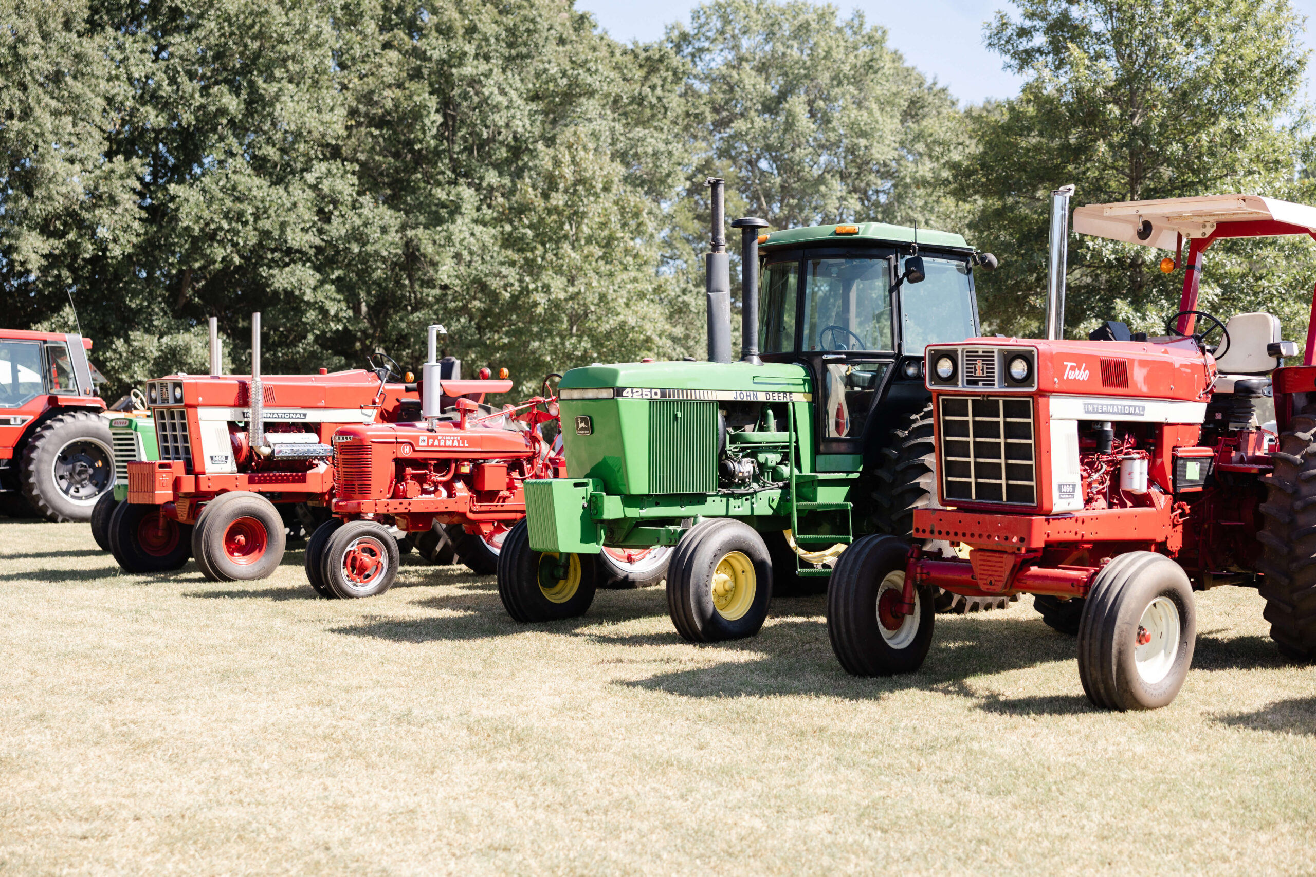 Four tractors lined up for tractor pull event