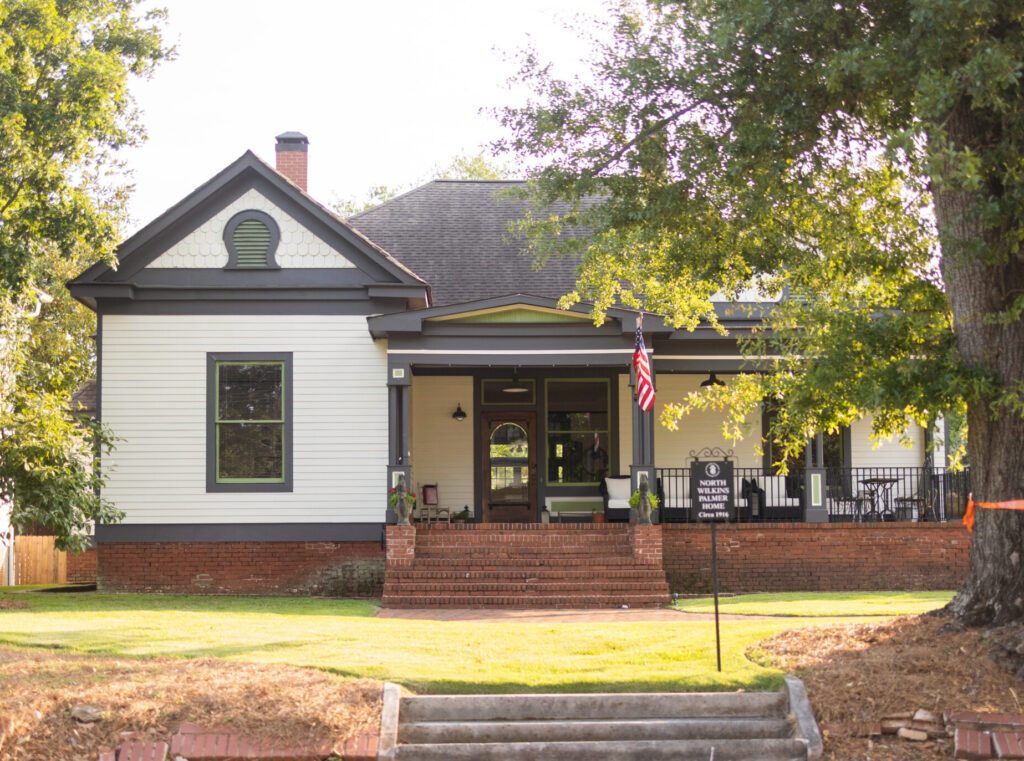 Craftsman Cottage Home with tree in front yard