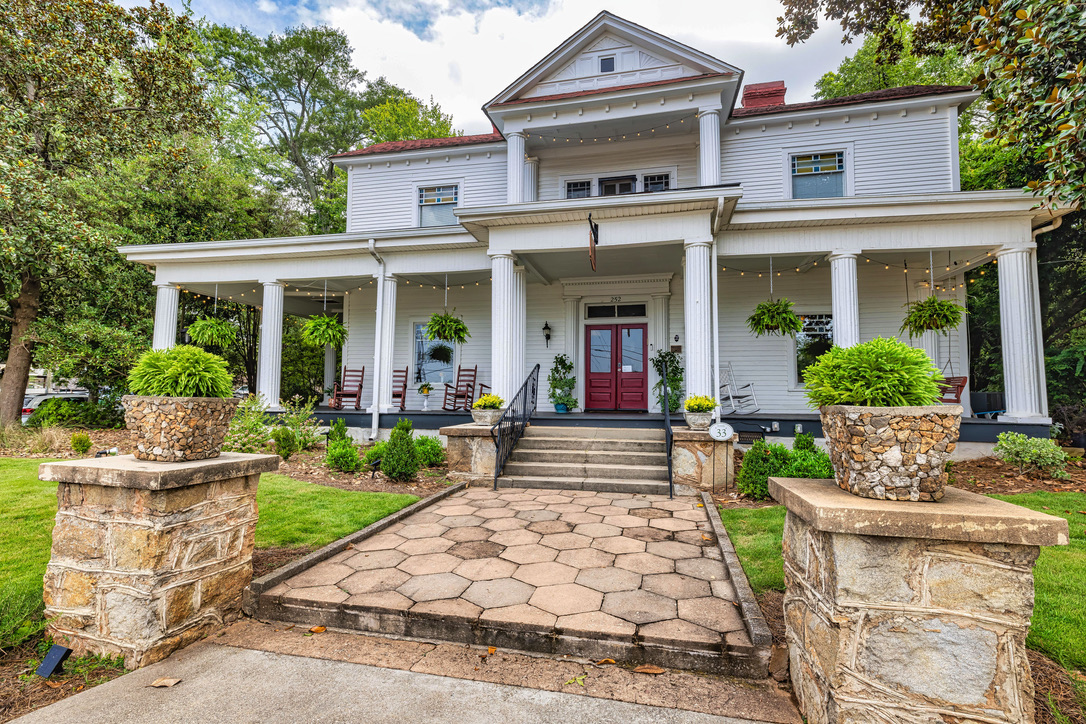 Front of Historic Bed and Breakfast Inn with front porch and walkway