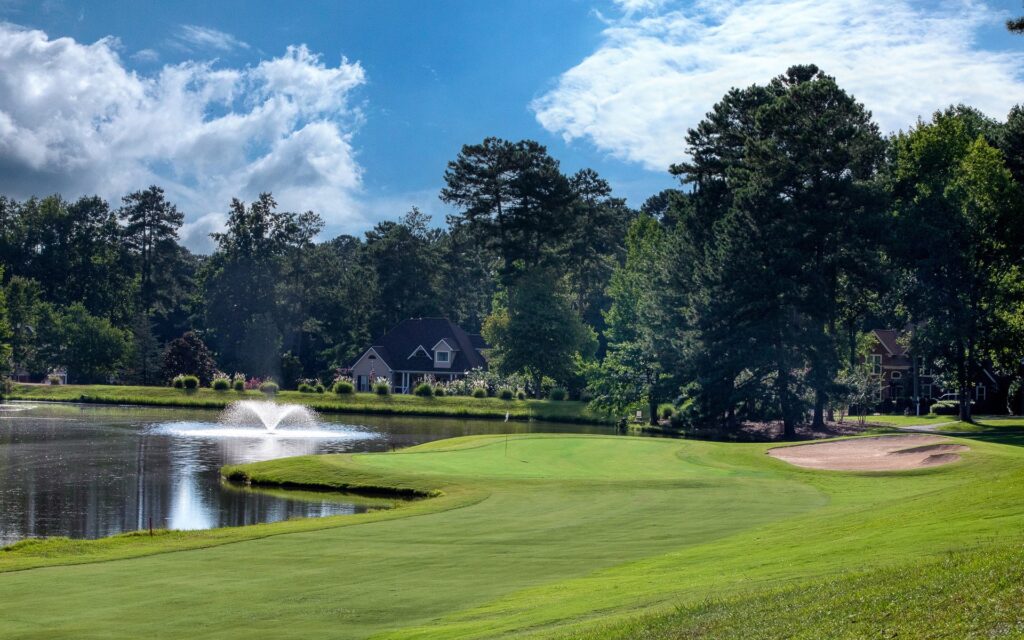 Golf course with pond and fountain